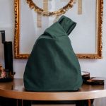 KNOT BAG IN FOREST GREEN VELVET FABRIC AND WHITE PEARLS